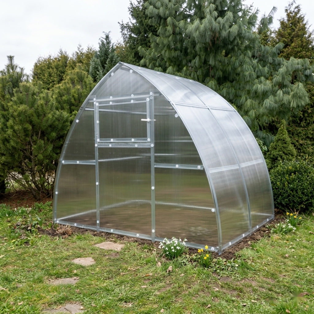 Serre de jardin L'Apogée en polycarbonate dans un jardin